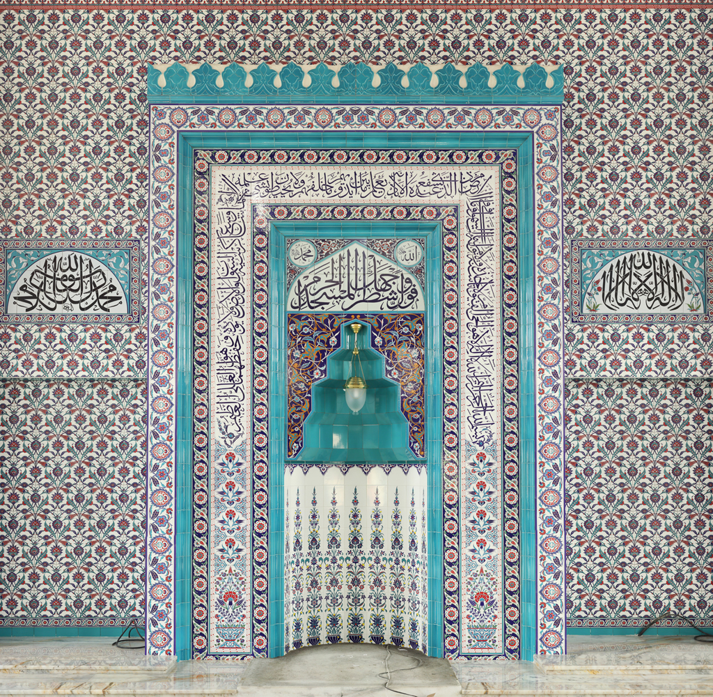 2024-09-12 14.48.44 - A beautifully designed mihrab with intricate Islamic geometric patterns and Arabic calligraphy, in gold and navy blue. The structure is rectangular wi.png